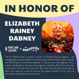 All Variants | Description of the Liz Market Tote in honor of Elizabeth Rainey Dabney with a pink background and text.