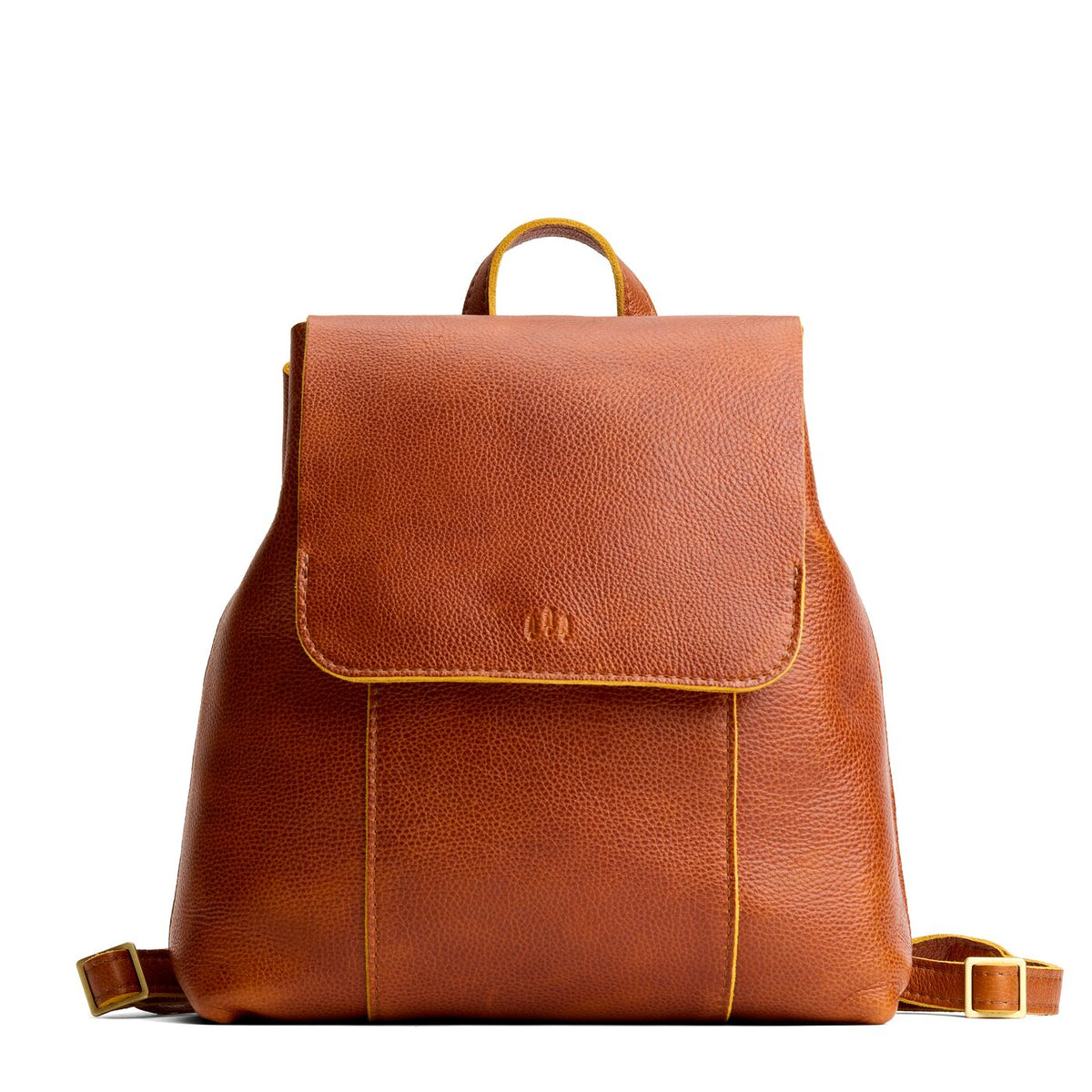 Sienna | Leather backpack with magnetic flap closure on a white background