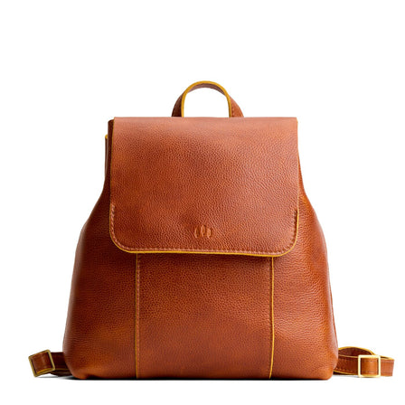 Sienna | Leather backpack with magnetic flap closure on a white background