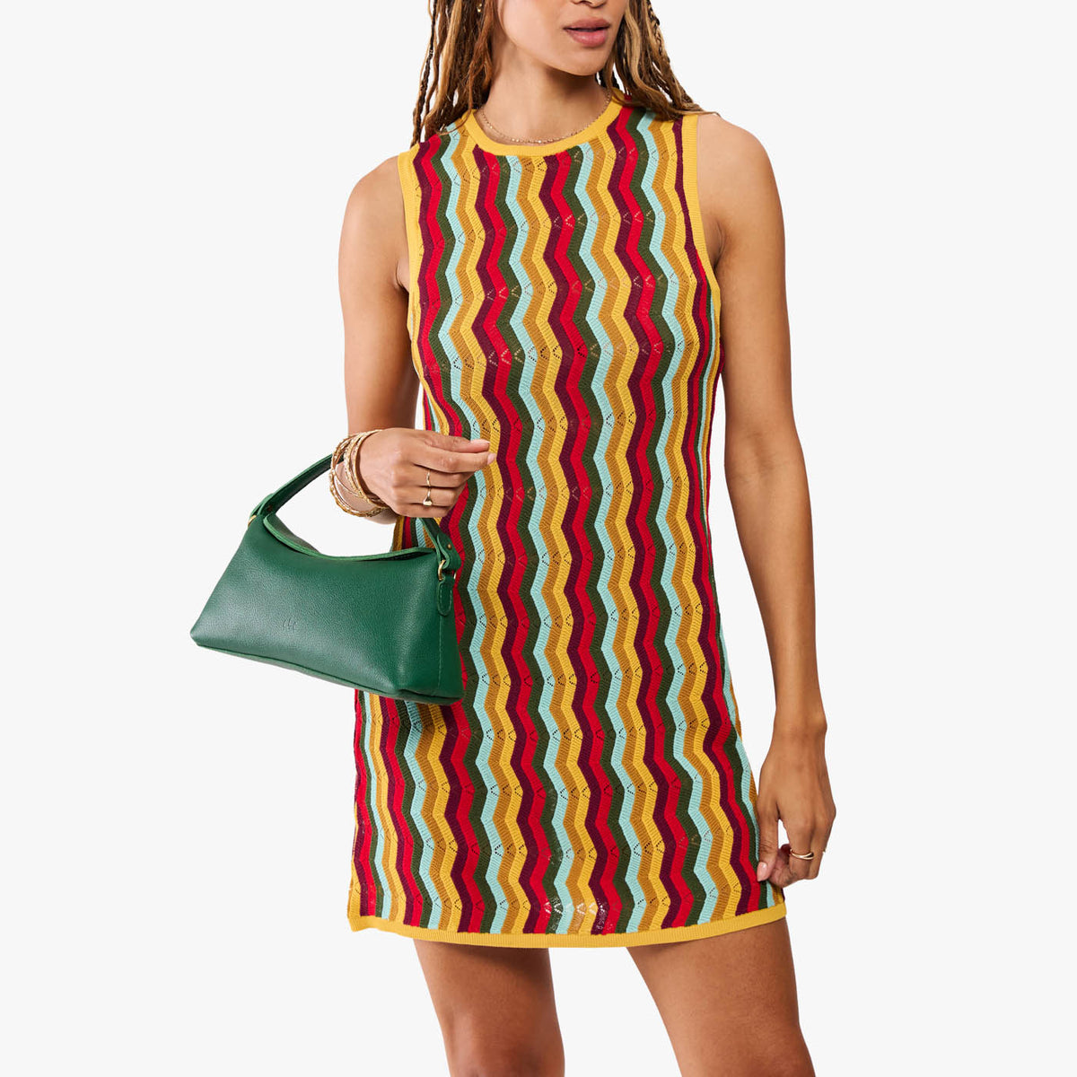 Bacalar | Model holding a green bowler style hand bag 