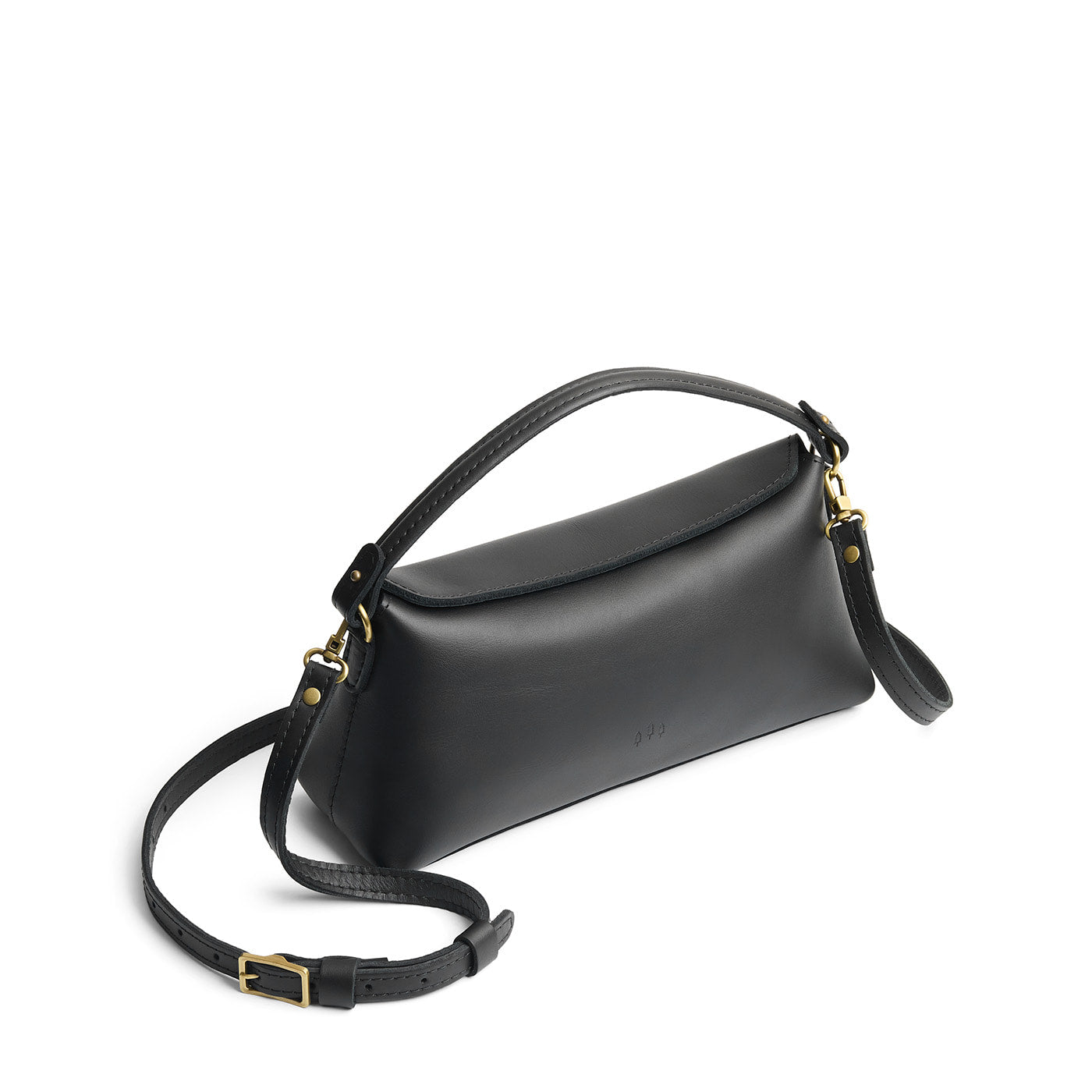 Black | Leather bowler bag with magnetic closure against a white background
