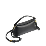 Black | Leather bowler bag with magnetic closure against a white background