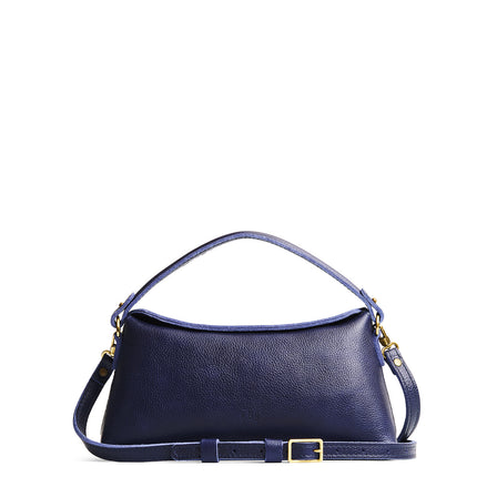 Cobalt | Leather bowler bag with magnetic closure against a white background