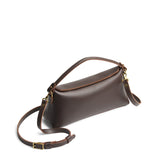 Grizzly | Leather bowler bag with magnetic closure against a white background