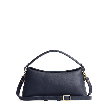 Night Owl | Leather bowler bag with magnetic closure against a white background