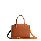 Honey Medium | Leather tote bag with handles, adjustable crossbody strap, zipper top, and two back pockets