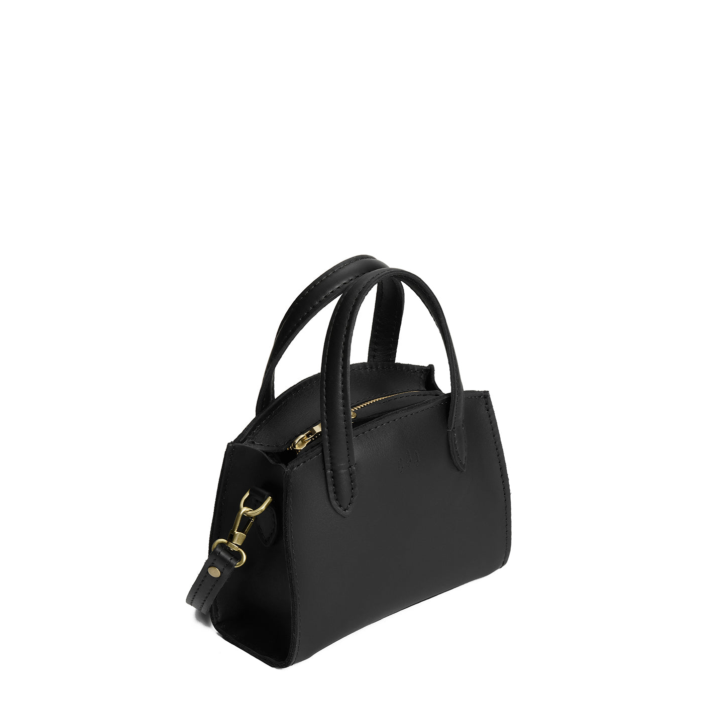 Black*Mini | Leather tote bag with handles, adjustable crossbody strap, zipper top, and a back pocket