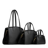Black | Size comparison image of Mini, Medium, and Large-sized leather tote bags with handles, adjustable crossbody strap, zipper top, and back pockets