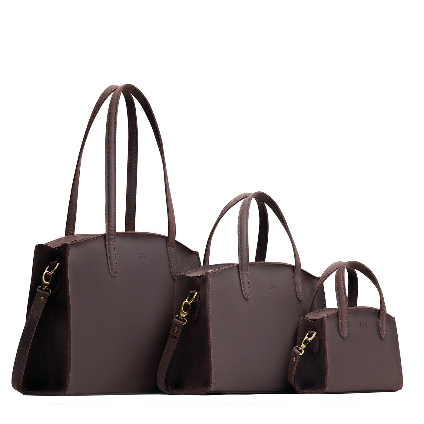 Moose | Size comparison image of Mini, Medium, and Large-sized leather tote bags with handles, adjustable crossbody strap, zipper top, and back pockets