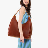 Nutmeg Oversized | U-shaped, flat-bottomed leather shoulder bag with adjustable strap