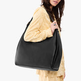 Pebbled--black Oversized | U-shaped, flat-bottomed leather shoulder bag with adjustable strap