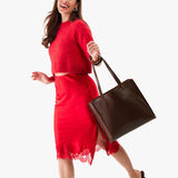 Chocolate Brown Large | Model holding leather tote bag with interior snap key loop