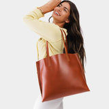 Madrone Large | Model holding leather tote bag with interior snap key loop