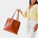 Madrone Large | Model holding leather tote bag with interior snap key loop