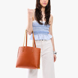 Sienna Medium | Model carrying leather tote bag with matching leather handles