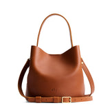 Honey Small | Symmetrical bucket bag with handle, latch closure, and removable crossbody strap