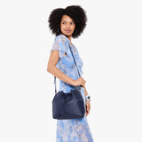 Cobalt Large | Model wearing slouchy crossbody bag with drawstring closure