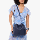 Cobalt Large | Model wearing slouchy crossbody bag with drawstring closure