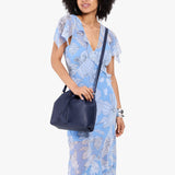 Cobalt Large | Model wearing slouchy crossbody bag with drawstring closure