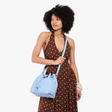 Skyway Large | Model wearing slouchy crossbody bag with drawstring closure