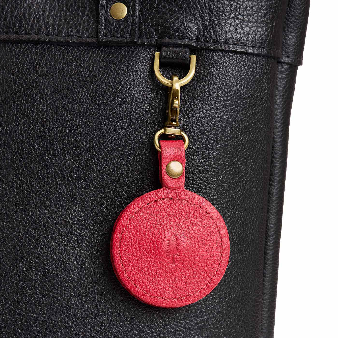 Cherry | Heart-shaped airtag holder keychain with a swivel lobster clasp on bag
