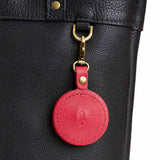 Cherry | Heart-shaped airtag holder keychain with a swivel lobster clasp on bag
