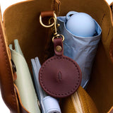 Cognac | Circle-shaped airtag holder keychain with a swivel lobster clasp