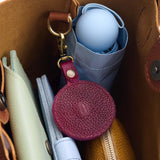 Orchid | Circle-shaped airtag holder keychain with a swivel lobster clasp