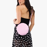 Pinkaboo Large | Model wearing circle shaped crossbody bag with top zipper