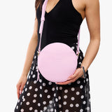 Pinkaboo Large | Model wearing circle shaped crossbody bag with top zipper
