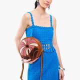 Wildflower Sienna Large | Model holding circle shaped crossbody bag with top zipper