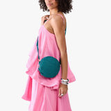 Aquarius Small | Model wearing circle shaped crossbody bag with top zipper