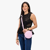 Pinkaboo Small | Model wearing circle shaped crossbody bag with top zipper
