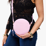 Pinkaboo Small | Model wearing circle shaped crossbody bag with top zipper