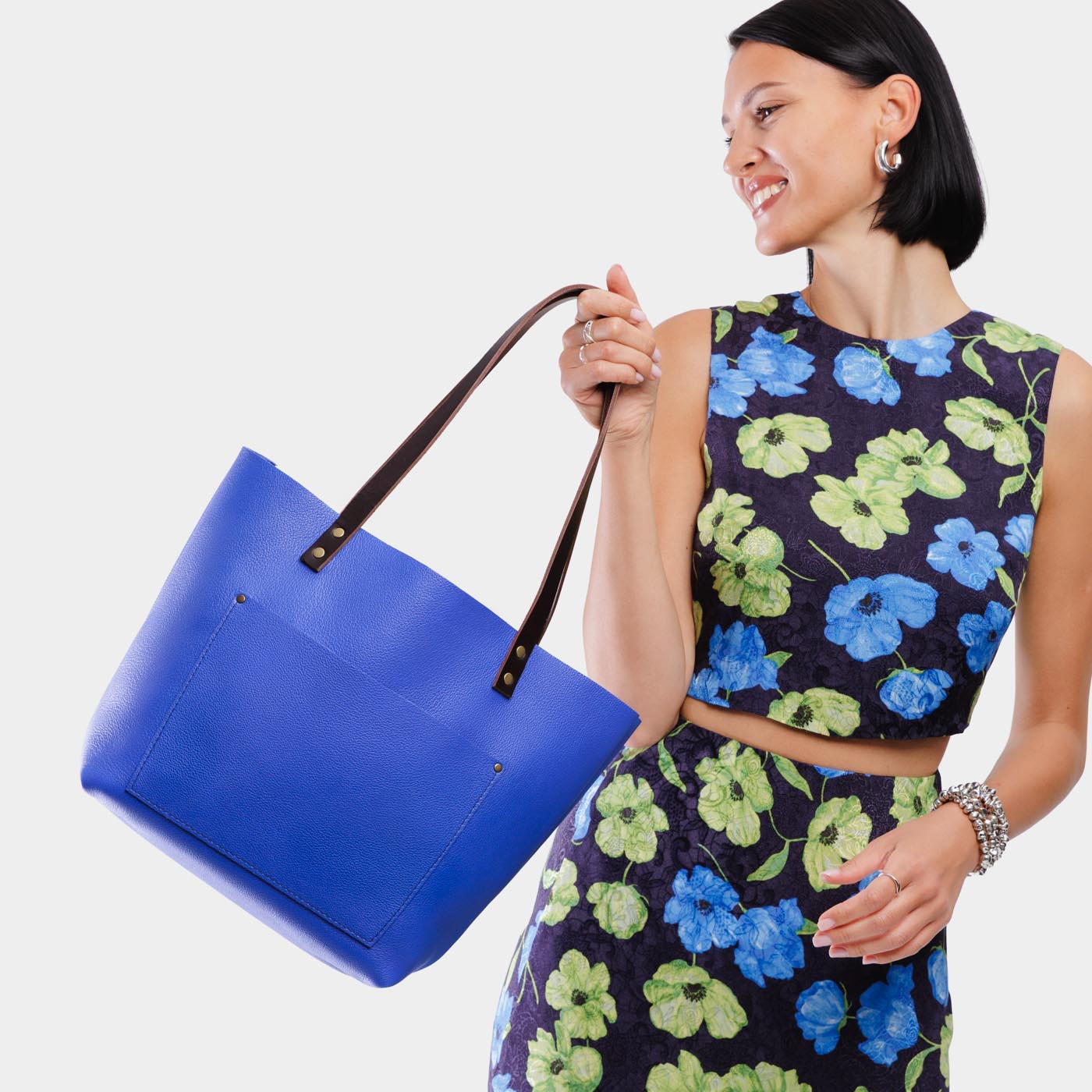 Astro Blue*Classic | Model wearing large leather tote bag with sturdy bridle handles and front pocket