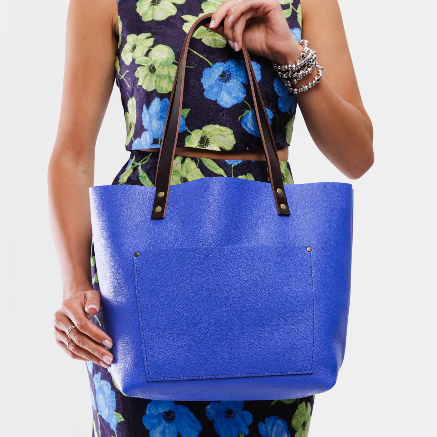 Astro Blue*Classic | Model wearing large leather tote bag with sturdy bridle handles and front pocket