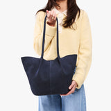Alaska Blue Large | Model holding a  leather tote bag 