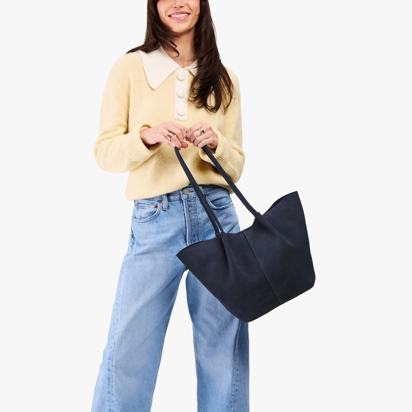 Alaska Blue*Large | Model holding wide bucket shaped tote bag with matching leather handles