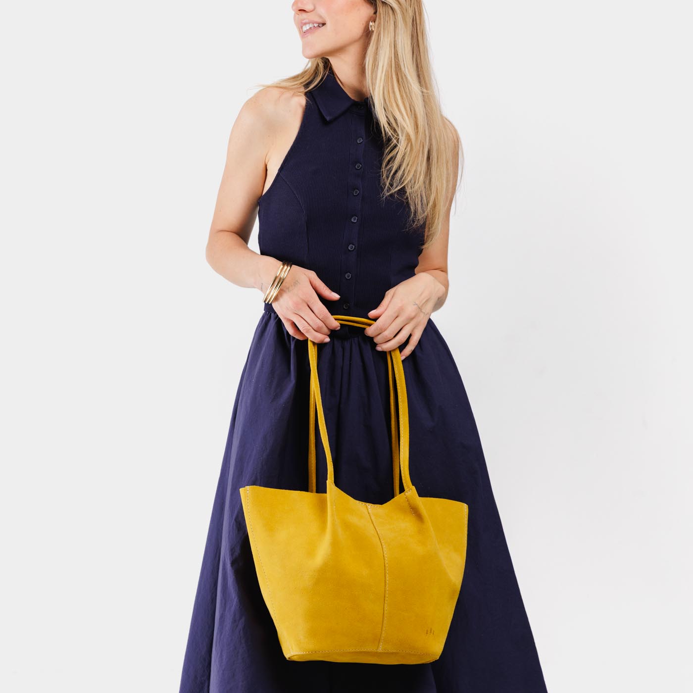 Hello Yellow*Large | Model holding a  leather tote bag 