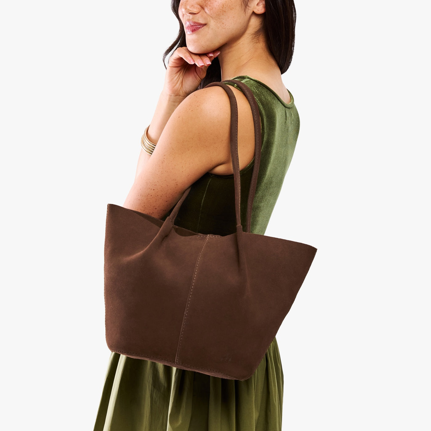 Stagecoach*Large | Model holding wide bucket shaped tote bag with matching leather handles