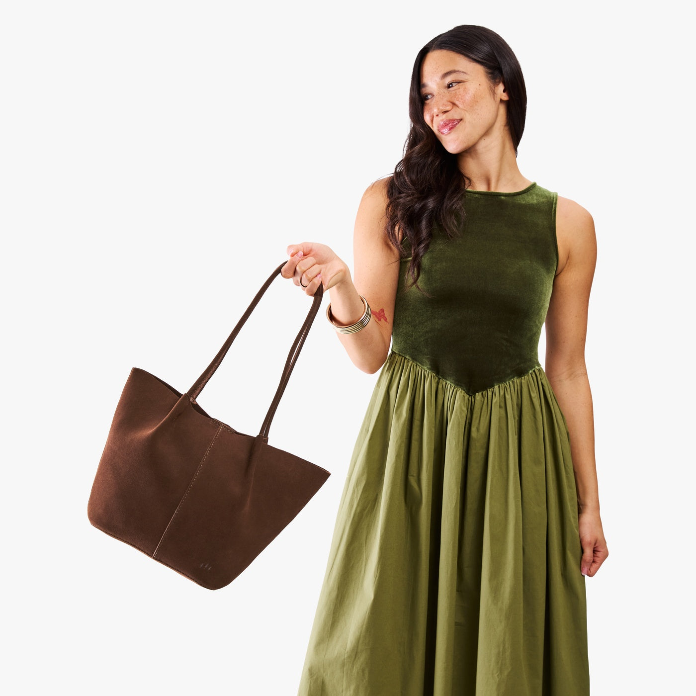 Stagecoach*Large | Model holding a  leather tote bag 