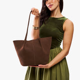 Stagecoach Large | Model holding wide bucket shaped tote bag with matching leather handles