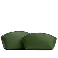 Cactus | Size comparison shot of two spacious leather makeup bags with curved seams and top zipper