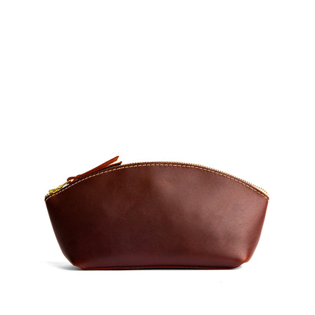 Cognac*Total Eclipse | Spacious leather makeup bag with curved seams and top zipper