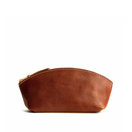 Nutmeg*Eclipse | Spacious leather makeup bag with curved seams and top zipper