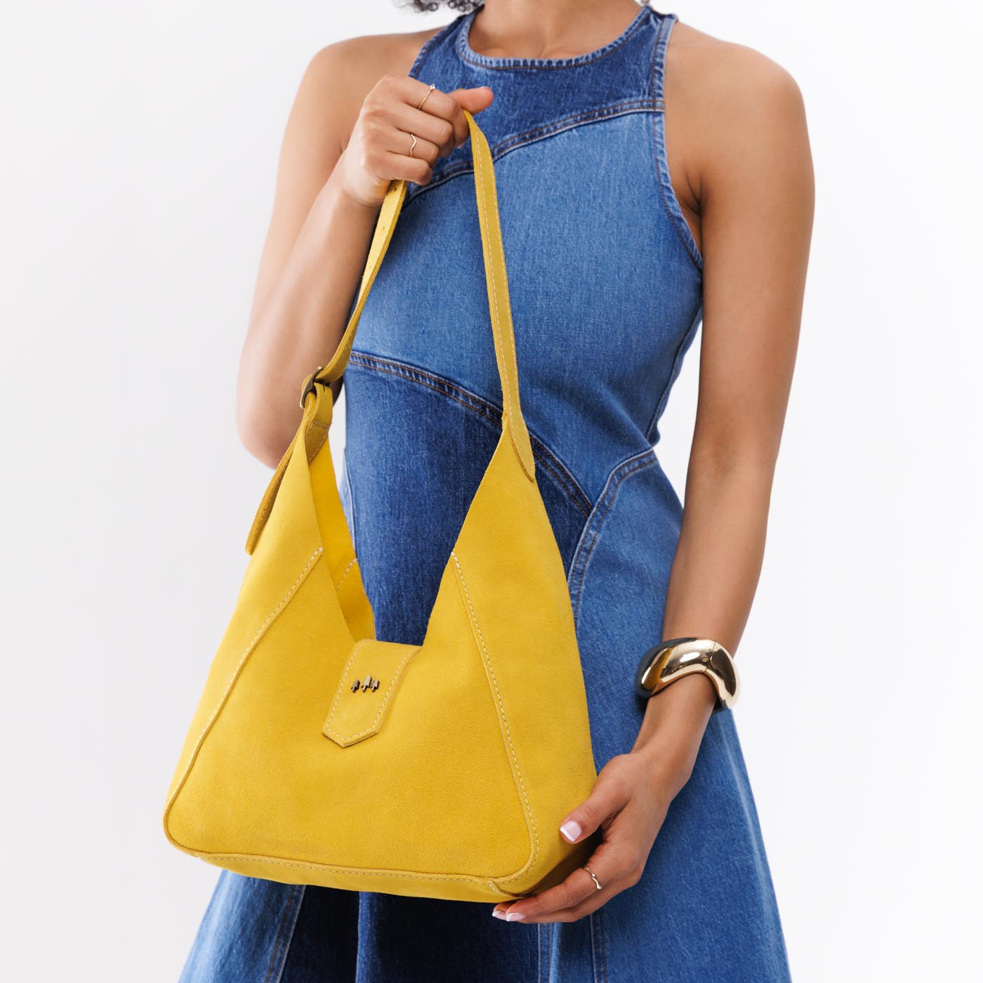 Hello Yellow | Model wearing structured hobo shoulder bag with adjustable strap and magnetic closure