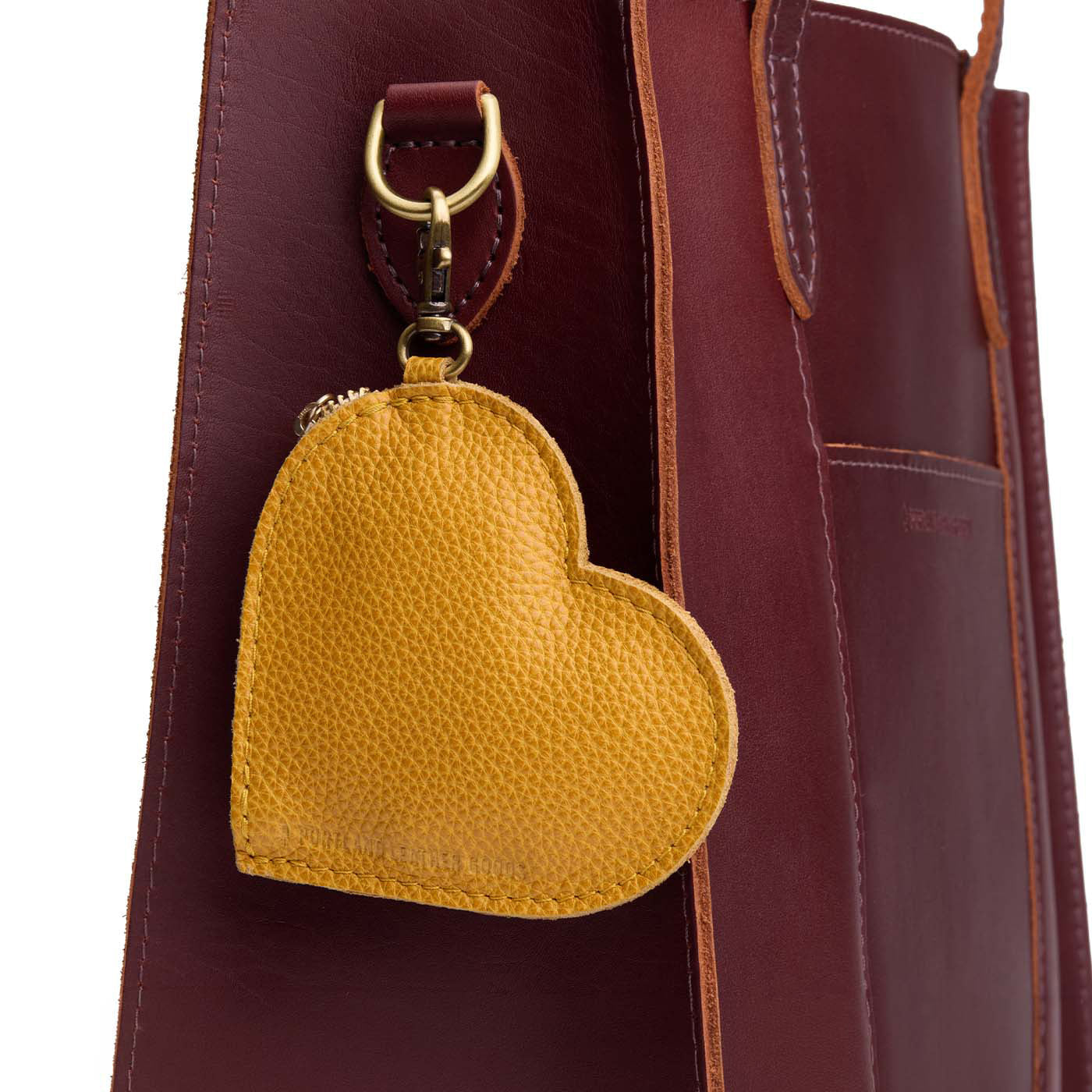Sunshine | Heart-shaped leather pouch keychain with zipper top and lobster clasp
