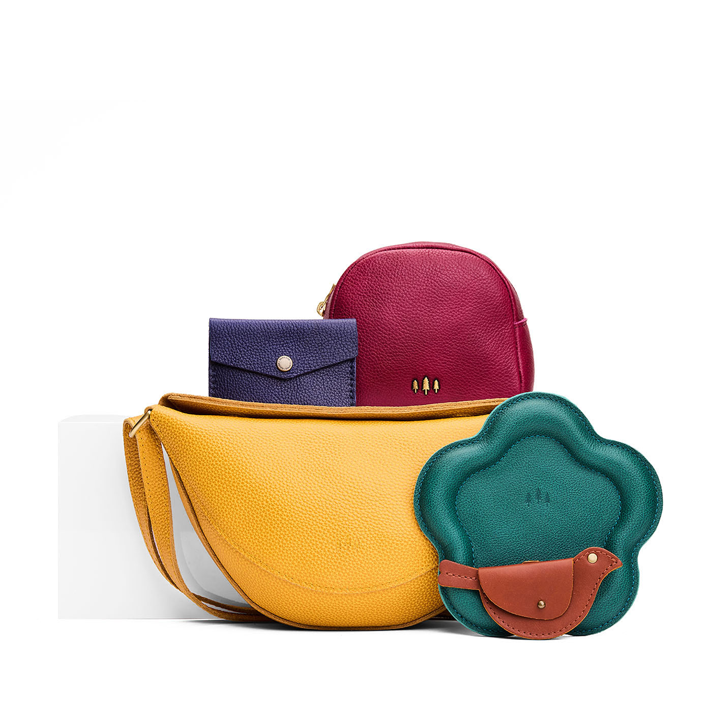 All Color: 1 Koala + 4 Items | Koala Sling Bag in Sunshine next to Mini Envelope Wallet, Wonder Pouch, Floral Trinket Tray, and a Mockingbird Pouch