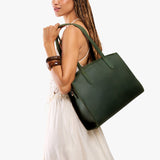 Evergreen Large | Model carrying leather tote bag with handles, adjustable crossbody strap, and two back pockets
