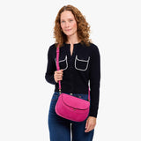 Royalty Large | Model wearing a leather Crossbody with a flap and magnetic closure